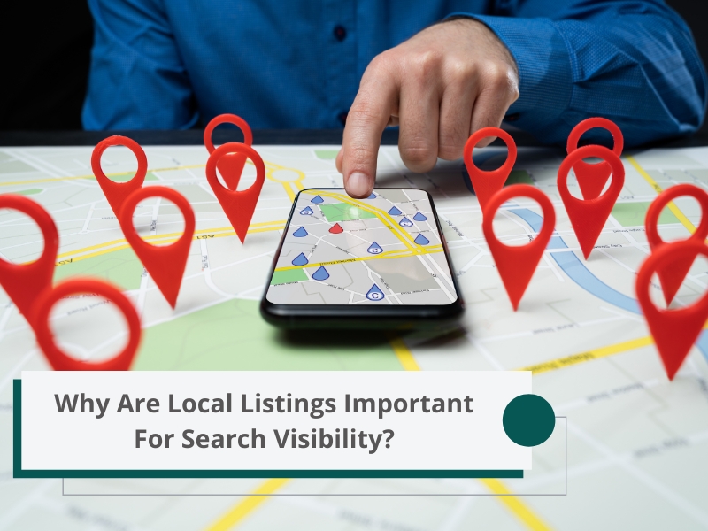 A person points to a smartphone with a map and location markers. Local Listings are essential for search visibility.